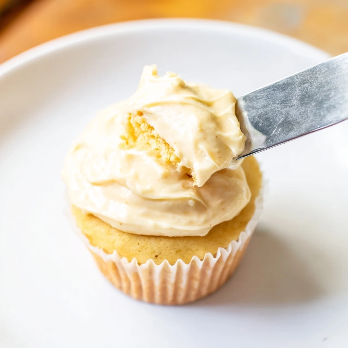 Fluffy vanilla cupcakes with swirls of buttercream frosting: a sweet, celebratory delight.
