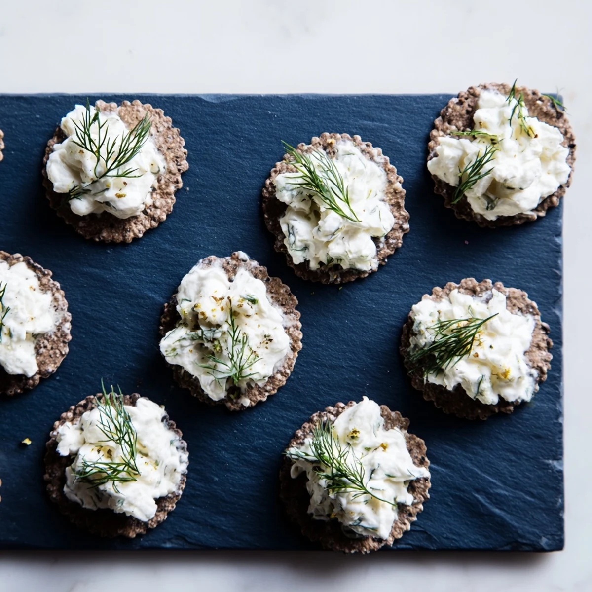 Crisp charcoal crackers topped with creamy goat cheese, this Stormy Sea appetizer looks spectacular.