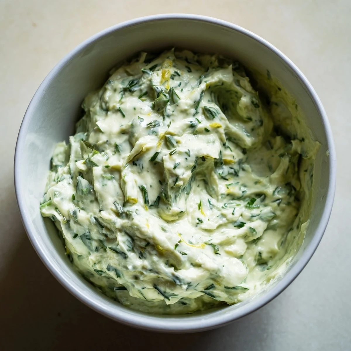 Creamy Green Goddess Dip, a vibrant, herb-packed dip ready to be scooped with crisp, fresh vegetables.
