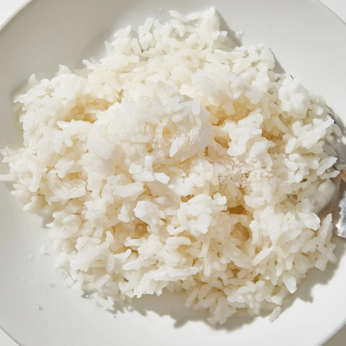 Fluffy Coconut Jasmine Rice, a creamy side dish, ready to be paired with vibrant curries.