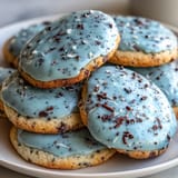 2. Delicate sugar cookies tinted robin's egg blue and speckled with cocoa, ideal for festive spring celebrations and cookie trays.