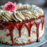 Pink velvet cake with rosé wine, drizzled in rich gold, perfect for celebrations.