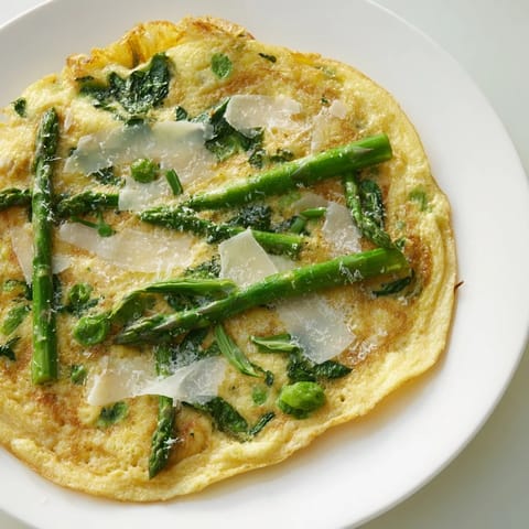 Savory Meadow-Soft Cozy Plate Frittata: goat cheese melts over fresh spring greens in this dish.