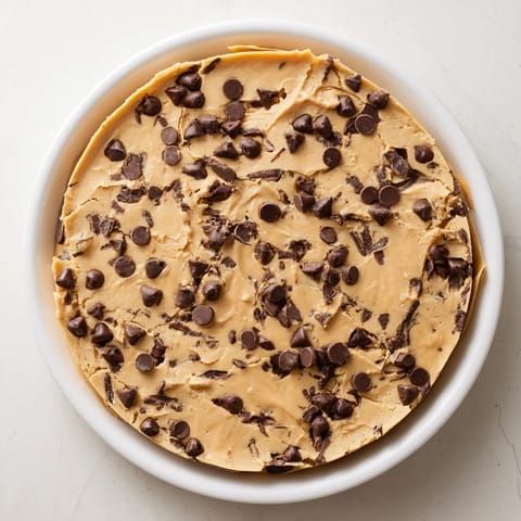 Golden-brown Peanut Butter Chocolate Chip Cookies piled up, a perfect sweet treat for sharing.