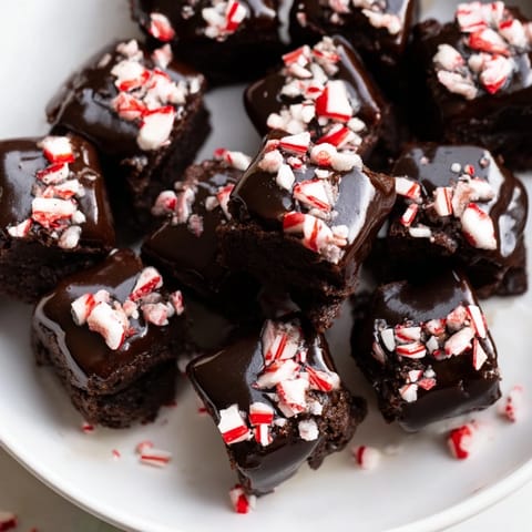 Close-up of decadent Peppermint Mocha Brownie Bites, perfect for a holiday dessert table, rich and chocolatey.