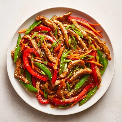 This sweet teriyaki pork stir-fry features a rich, umami sauce over perfectly cooked pork and crisp veggies.