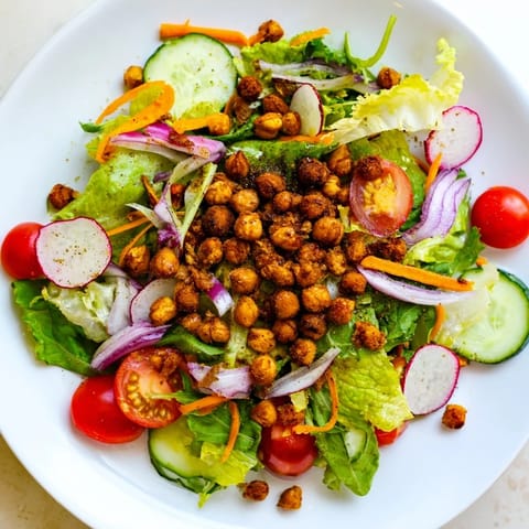 Golden, crunchy chickpea croutons top the fresh Mixed Greens Salad, making it a delicious vegan meal.
