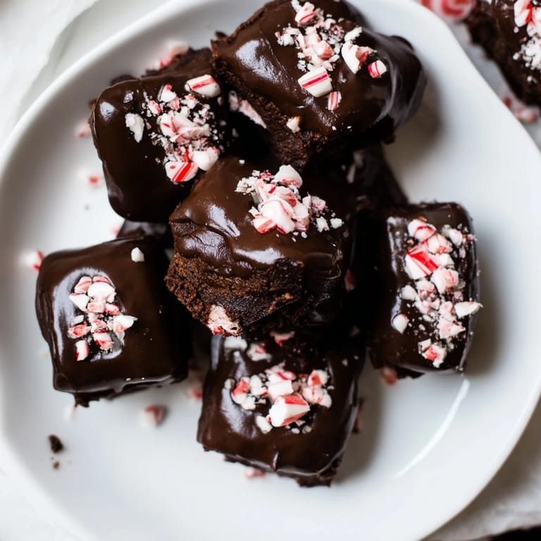 Miniature, bite-sized Peppermint Mocha Brownie Bites, showing a perfect, moist crumb and peppermint topping.