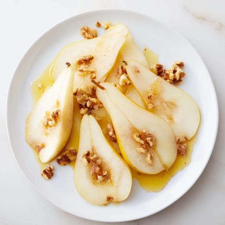 Close-up of juicy pear slices, glistening with honey, ready to eat for a quick treat.