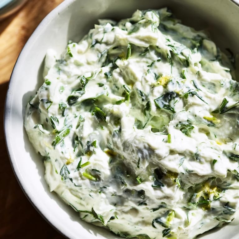 Bright green Green Goddess Dip—tangy and herbaceous—is wonderfully smooth, perfect for dipping crackers or pita bread.