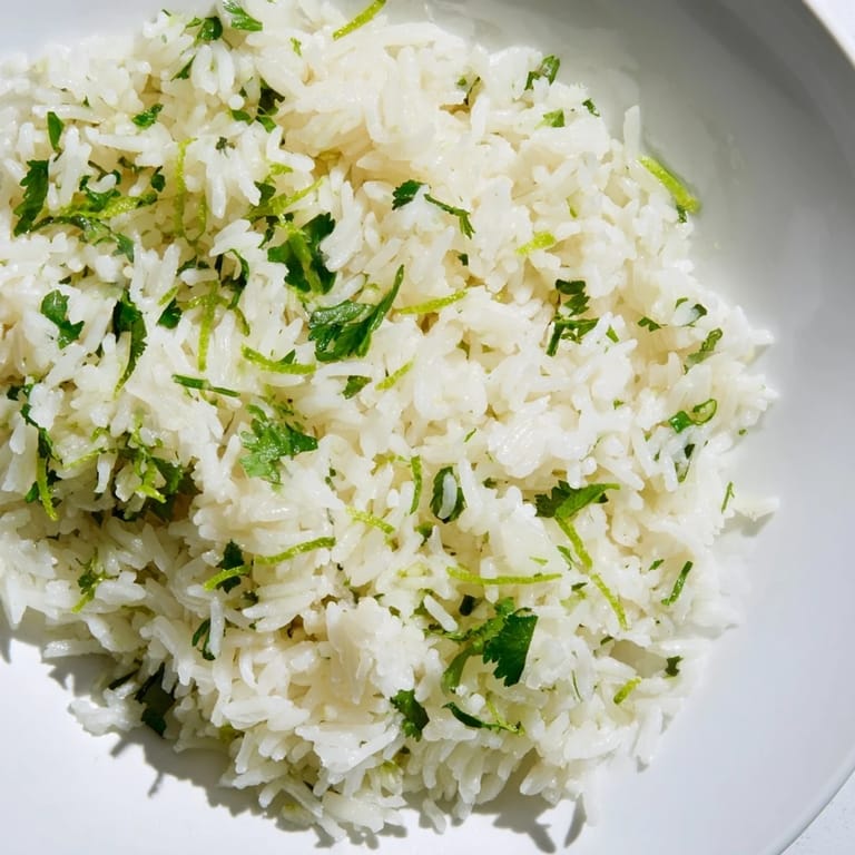 Steaming bowl of Cilantro Lime Rice, bursting with lime and cilantro flavors, perfect side dish.