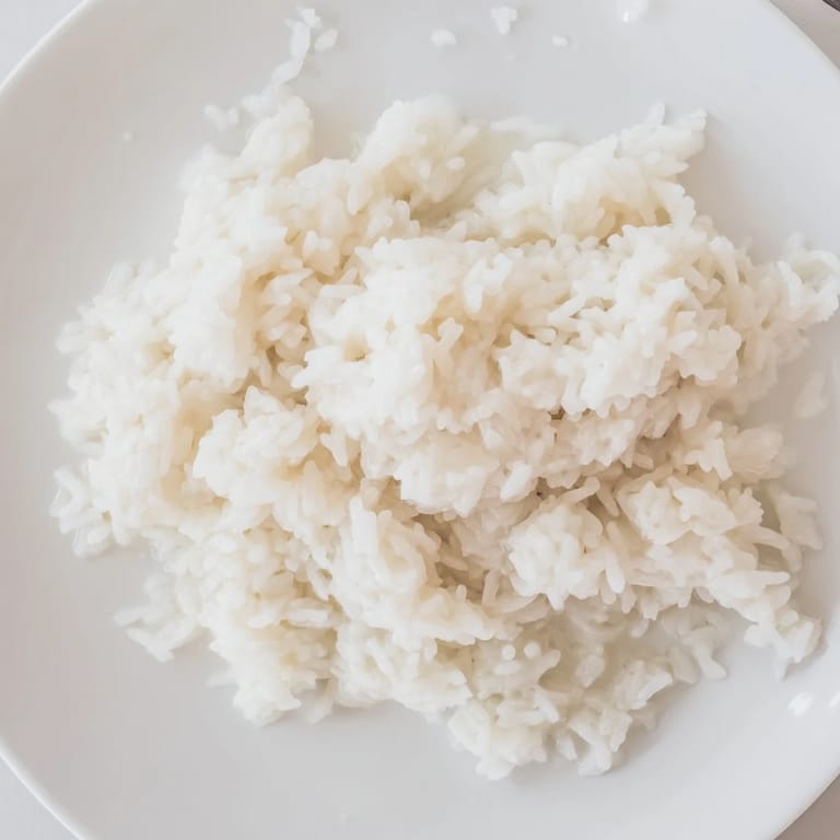 Warm and inviting shot of Coconut Jasmine Rice, cooked with coconut milk and ready to eat.